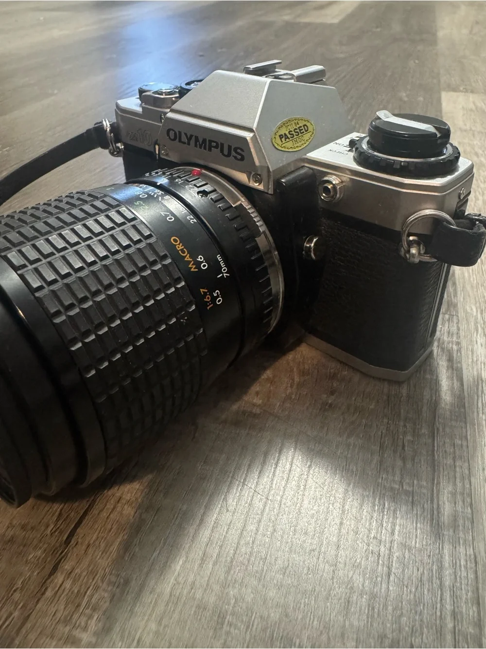 Olympus OM-10 35mm SLR Camera in Silver and Black with Telephoto Lens